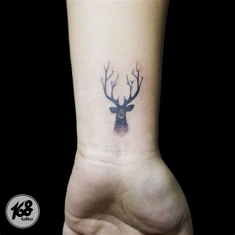 deer print tattoo|simple deer head tattoos.